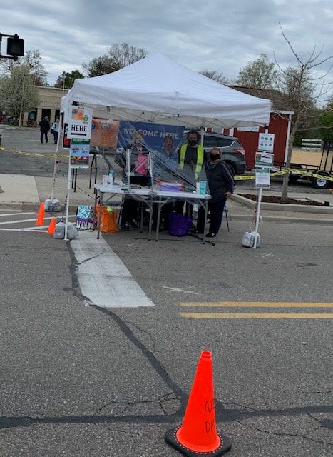 A white tent is set up on the side of the road