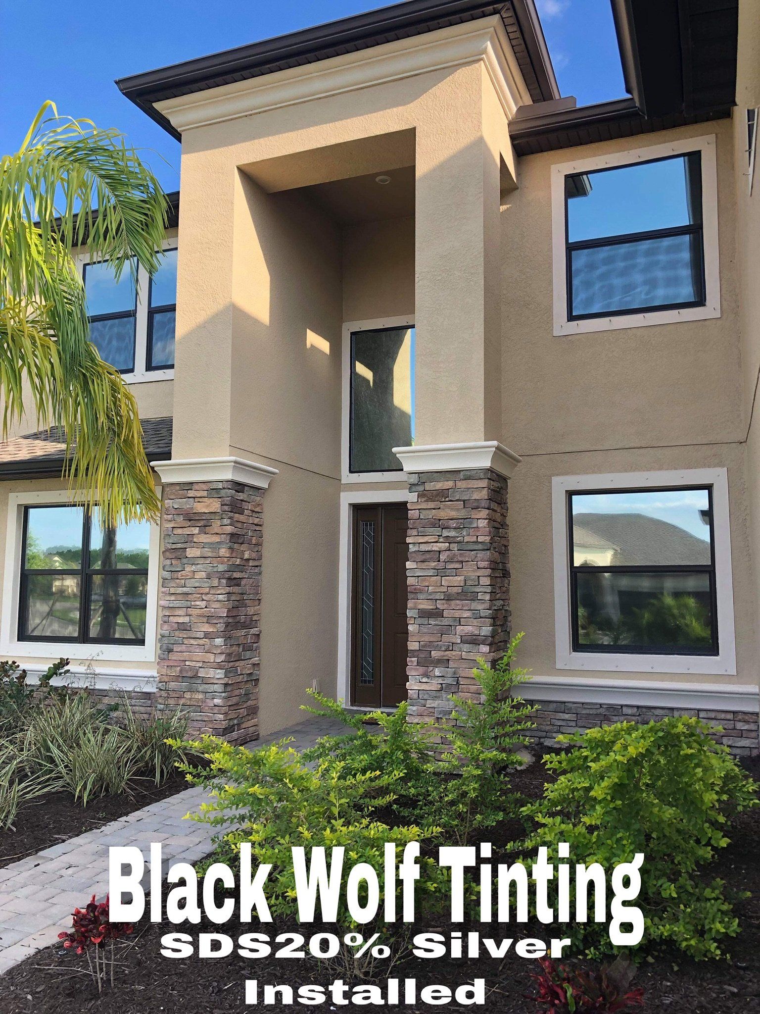 Modern House Exterior With Newly Tinted Window — Car Tinting Fort Myers FL — Black Wolf Tinting