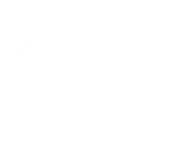 A person in a red uniform stands in a grassy field, using a handheld metal detector to search for items in the ground.