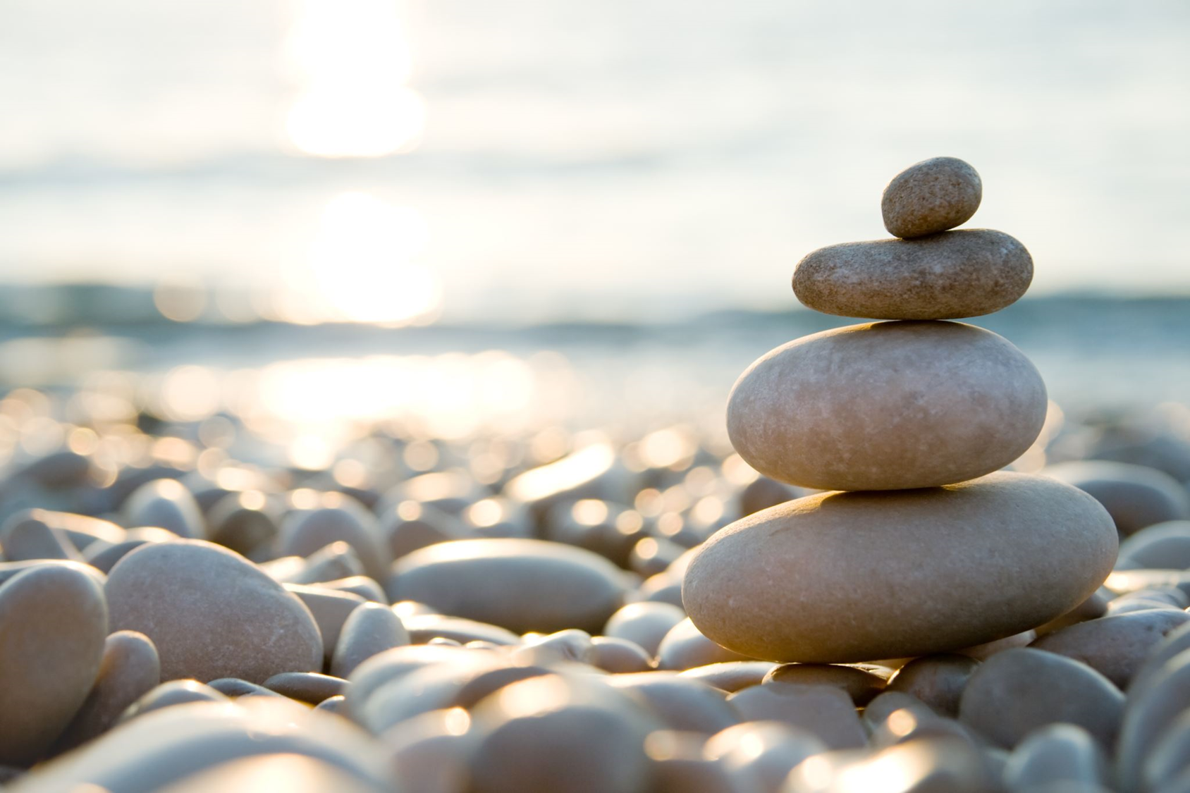 A pile of rocks stacked on top of each other on a beach
