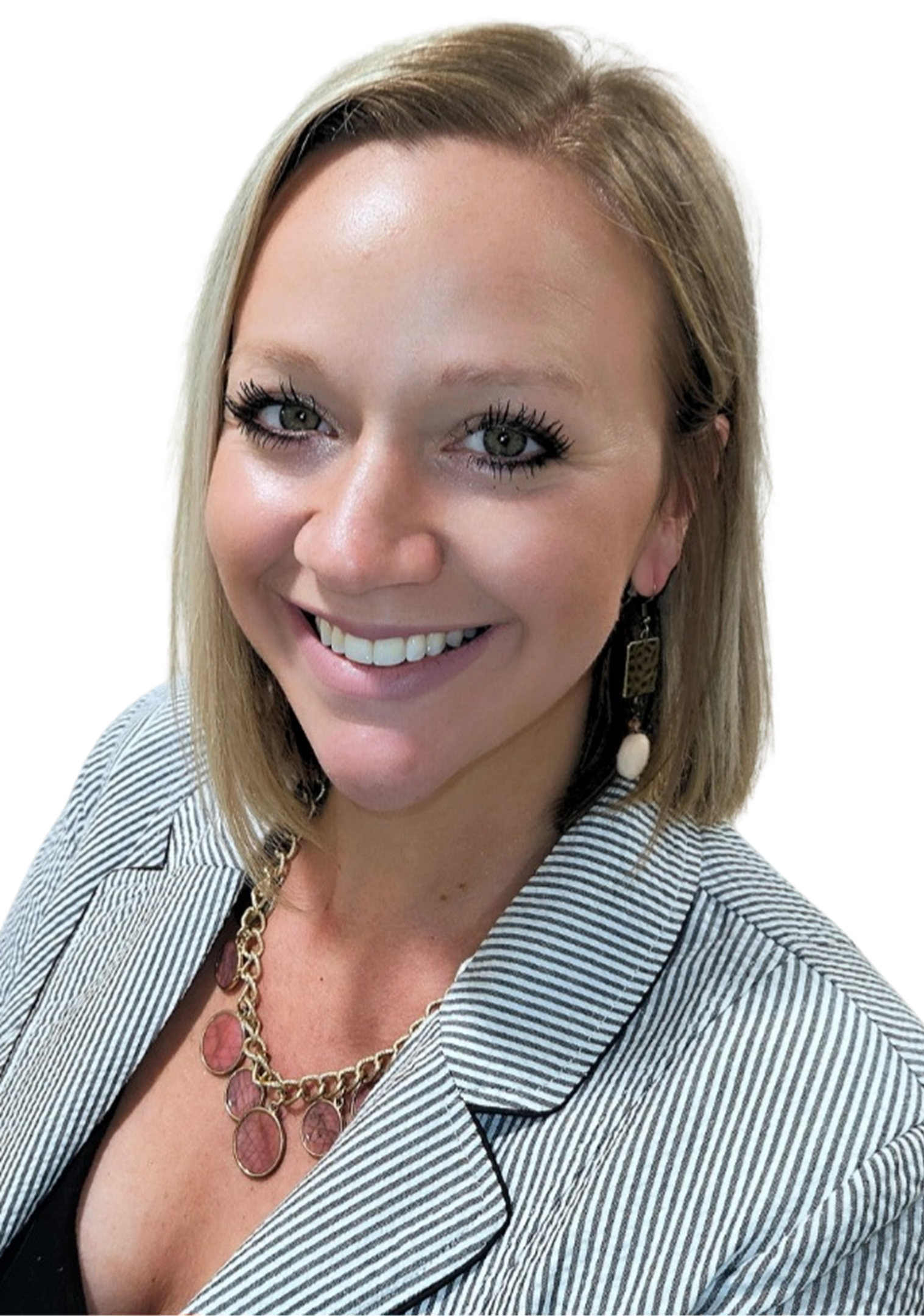 A woman wearing a striped jacket and a necklace is smiling for the camera.