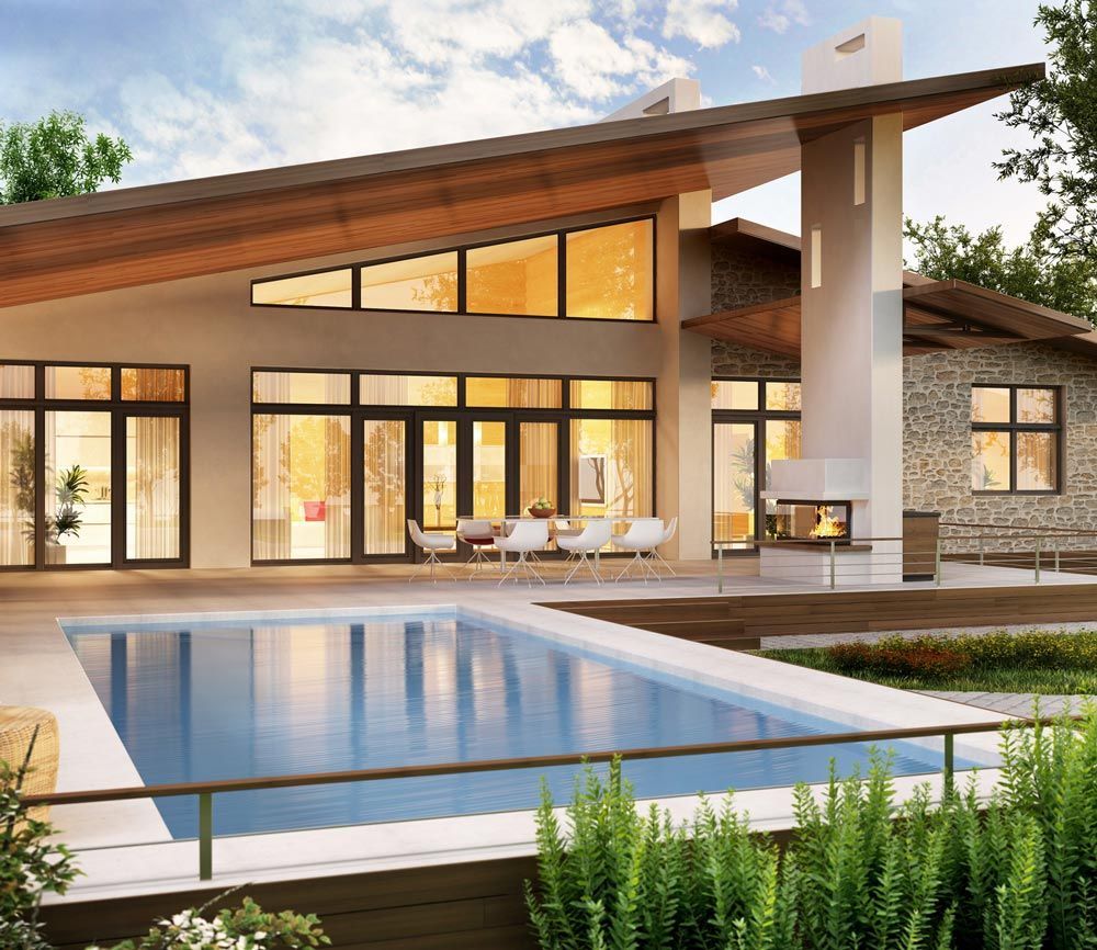 A large house with a swimming pool in front of it