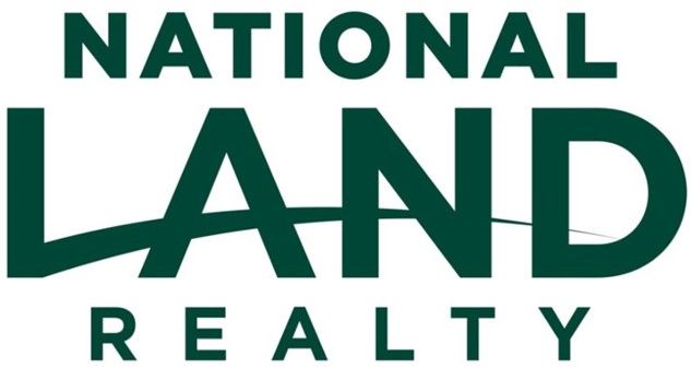 The logo for national land realty is green and black.