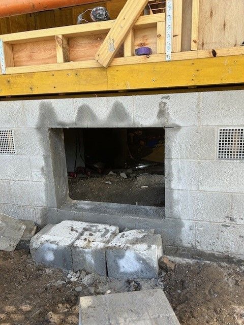 A brick wall with a hole in it that looks like a window