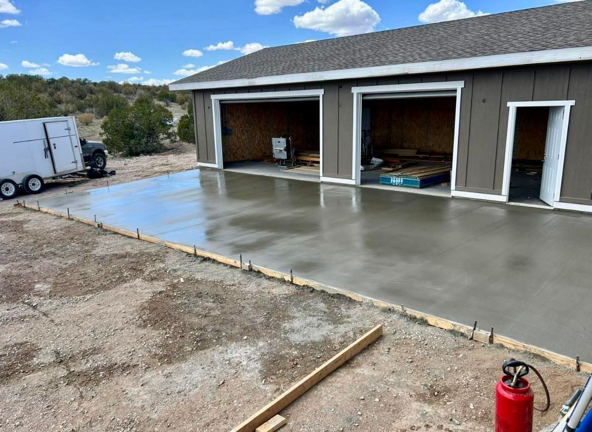 Garage under construction with new concrete slab.