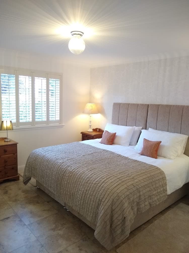 Bedroom with bed, side tables and lamps