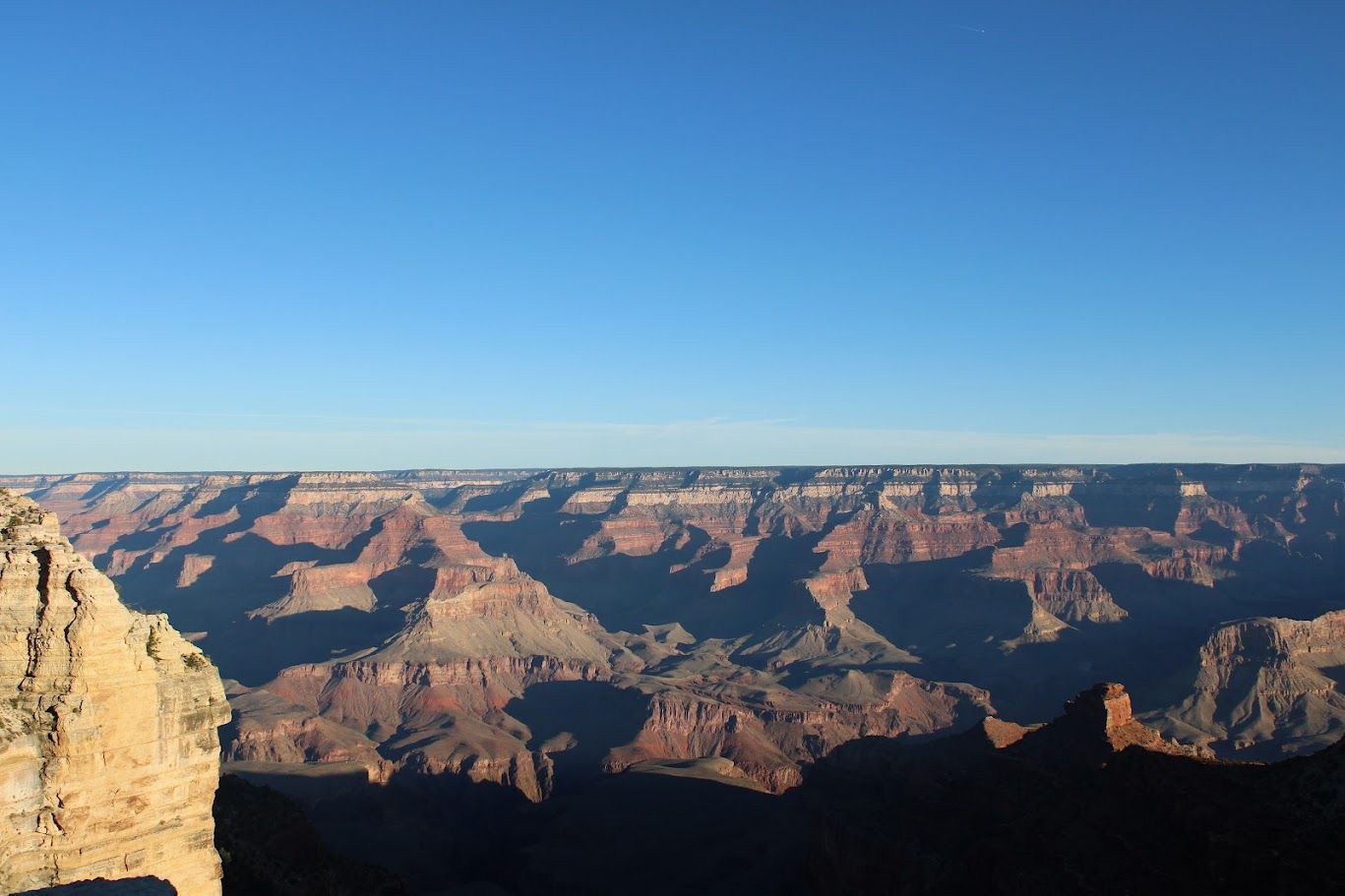 A view of the grand canyon on a sunny day