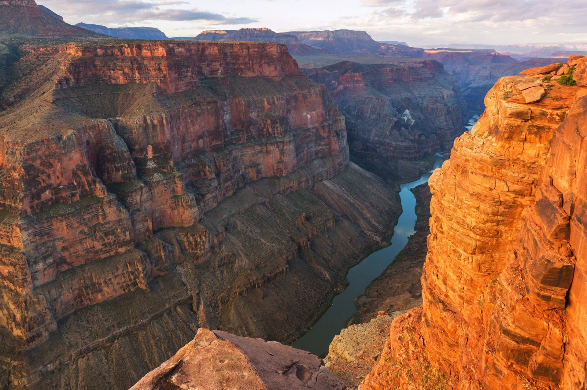 A river runs through a canyon between two cliffs.