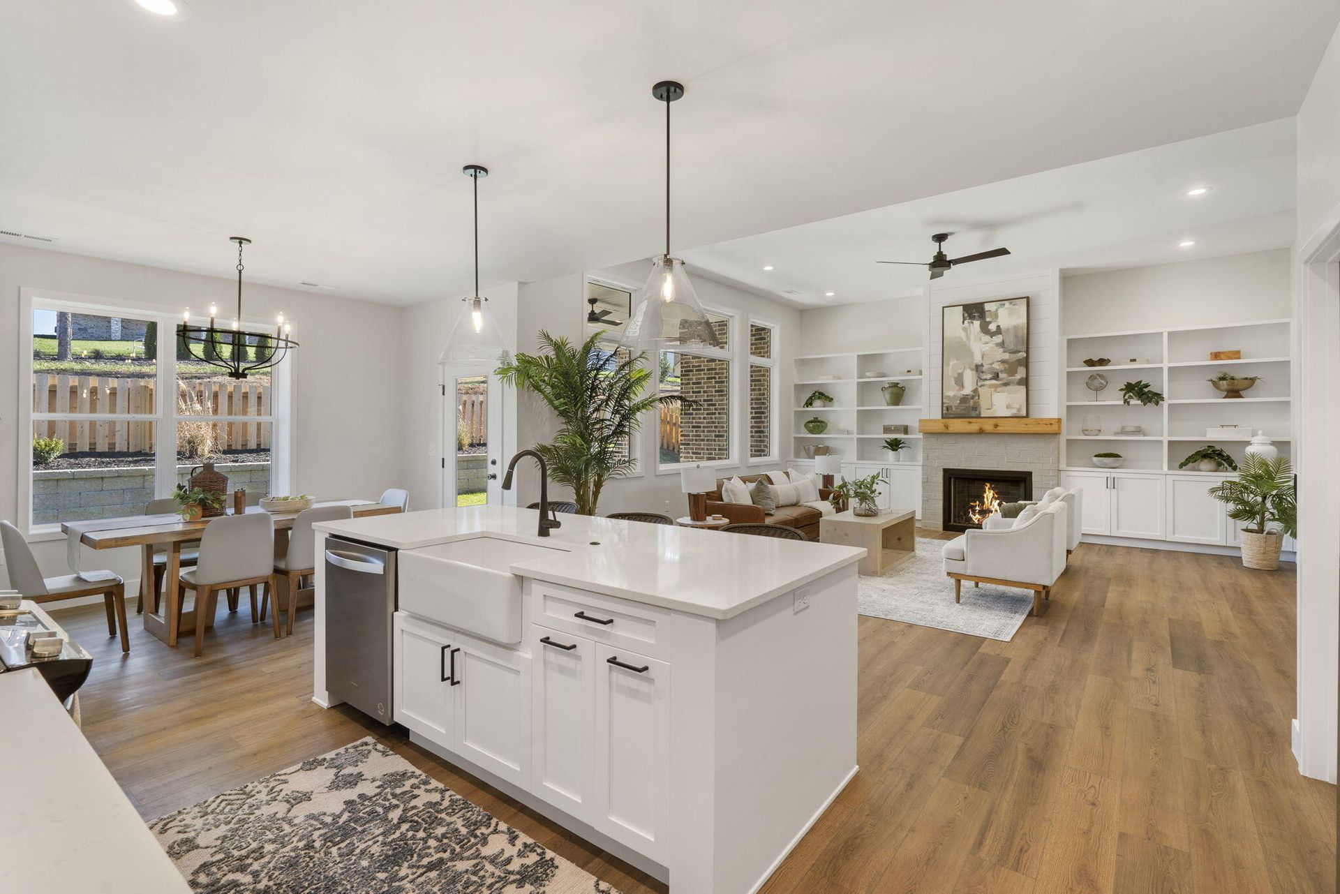 Brick building with a bright red door, black shutters, and white window shutters. Stone steps lead up to the entrance.