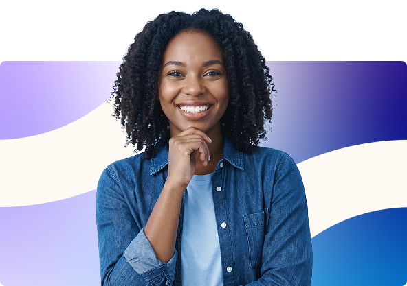 Smiling man with folded arms in a blue sweater against a white, purple, and blue abstract background