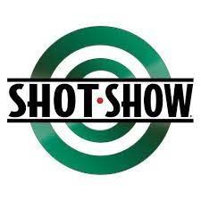 Ein Shot-Show-Logo mit einem grünen Ziel in der Mitte.