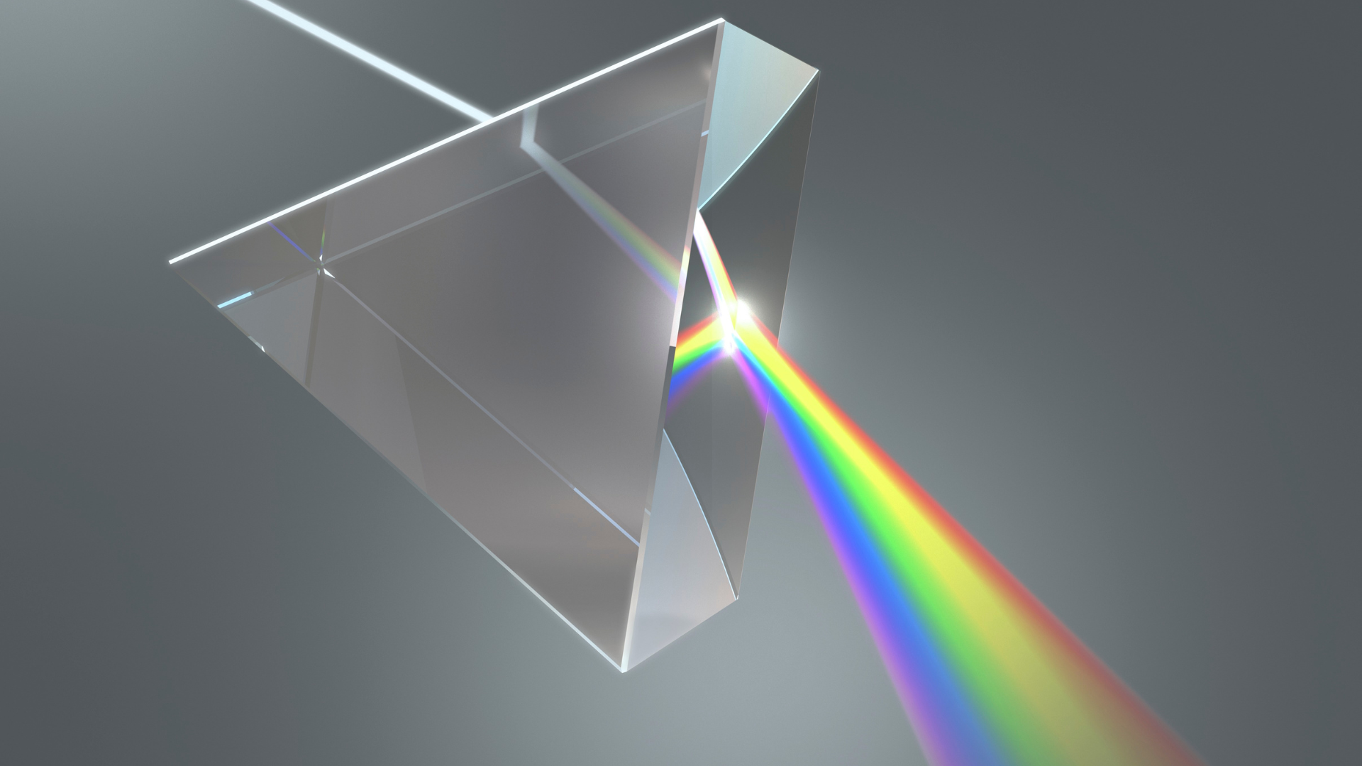 A rainbow is being reflected from a glass prism