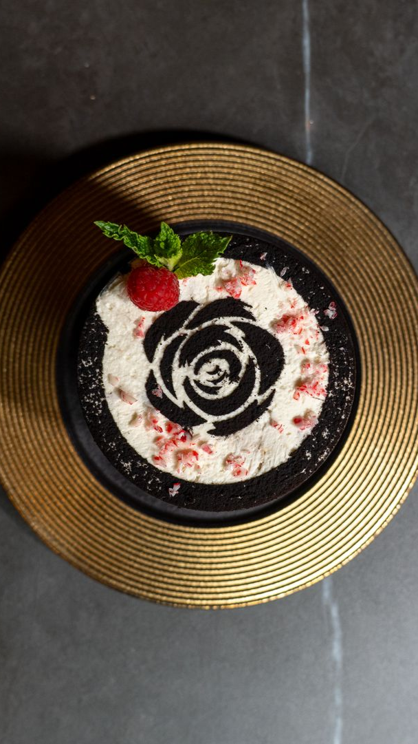 a person is pouring liquid into a glass filled with fruit .