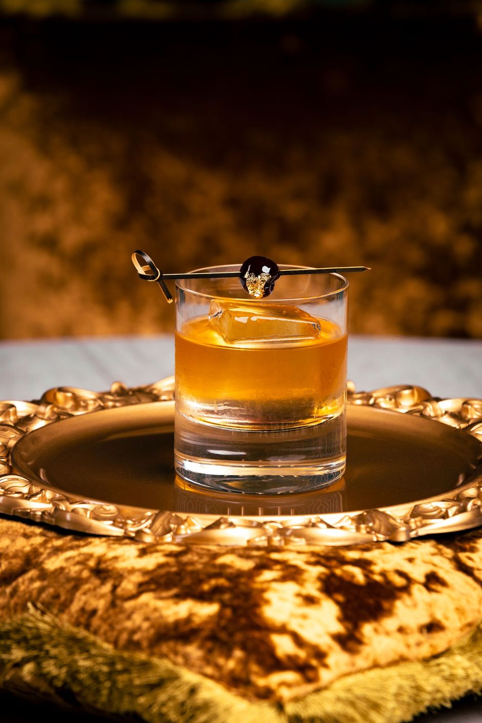 Royal Elixir whiskey based drink served on a gold plate