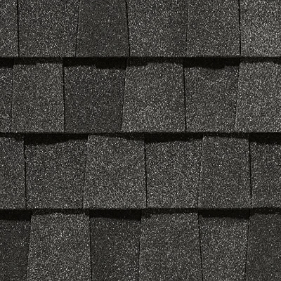 A close up of a row of black shingles on a roof.
