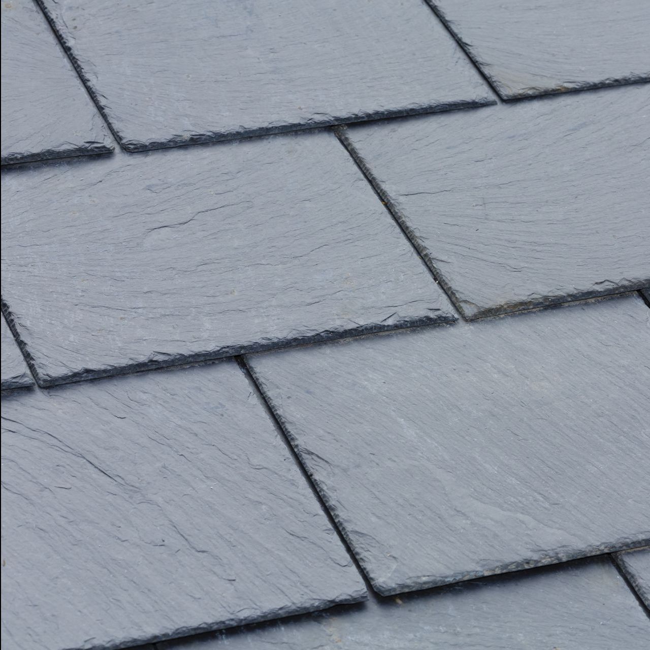 A close up of a roof made of slate tiles