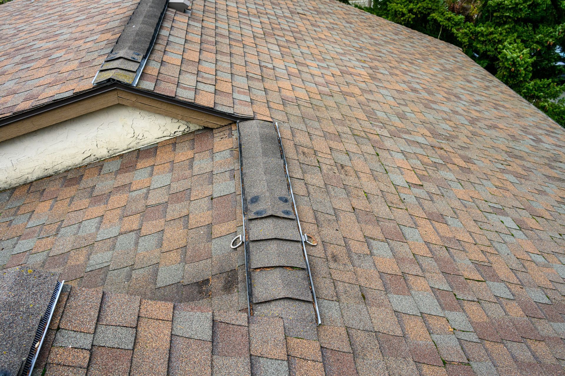 A close up of a roof with old shingles
