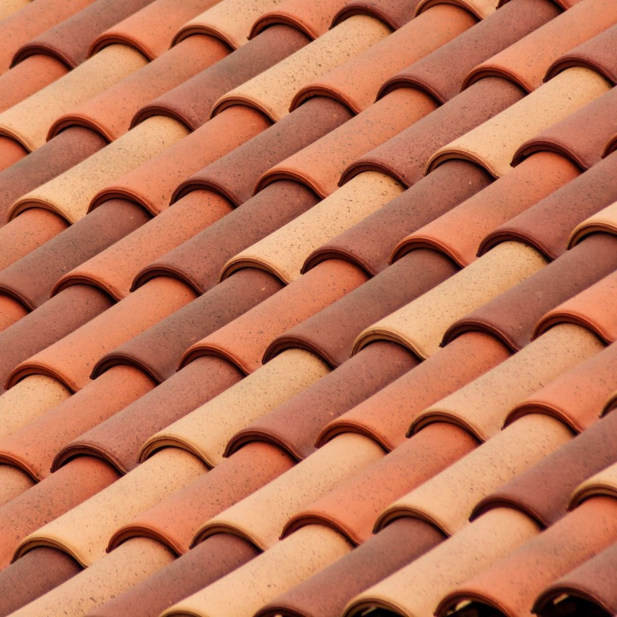 A close up of a row of tiles on a roof