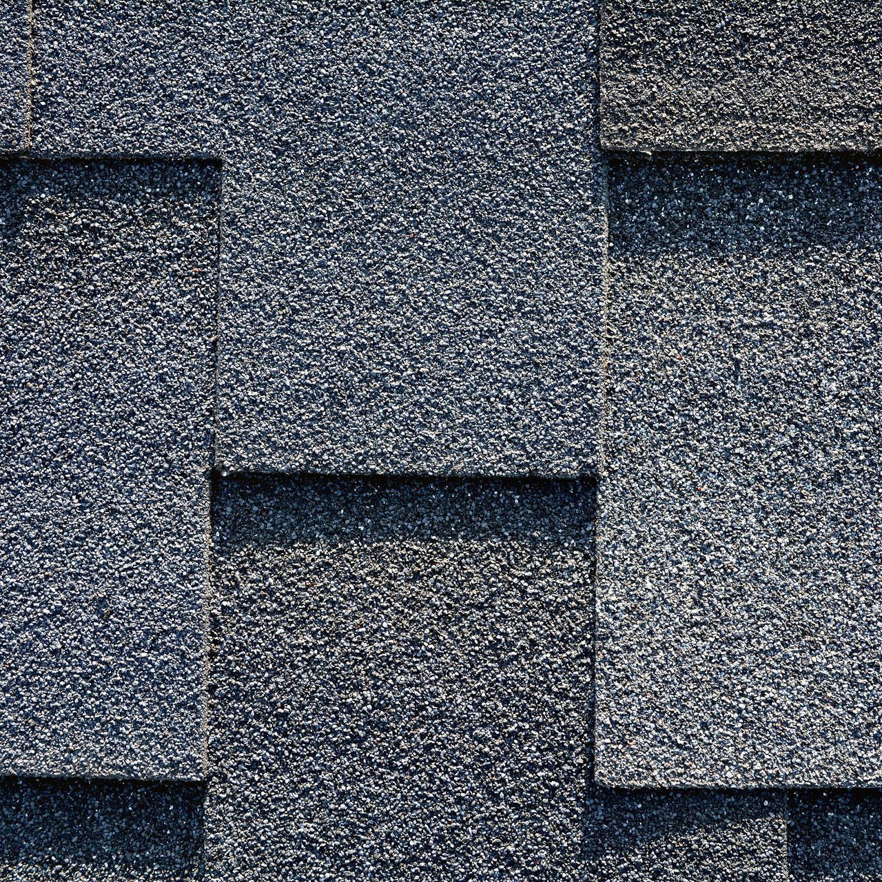 A close up of a gray shingle roof