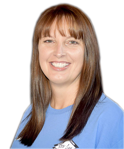 A woman in a blue shirt is smiling for the camera