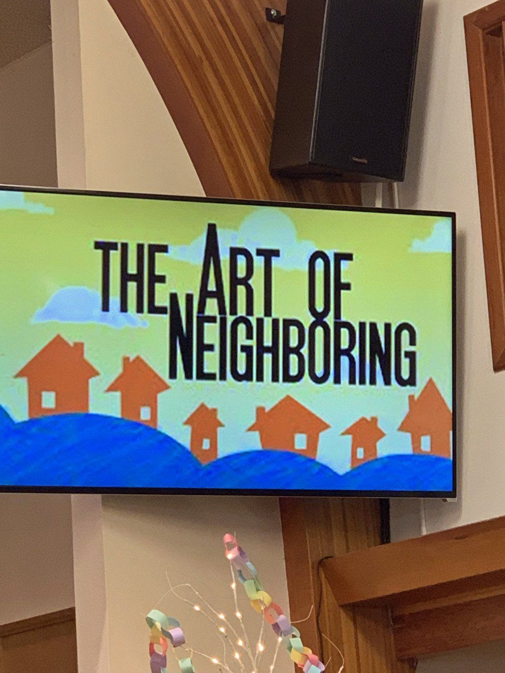 A tv screen displays the art of neighboring