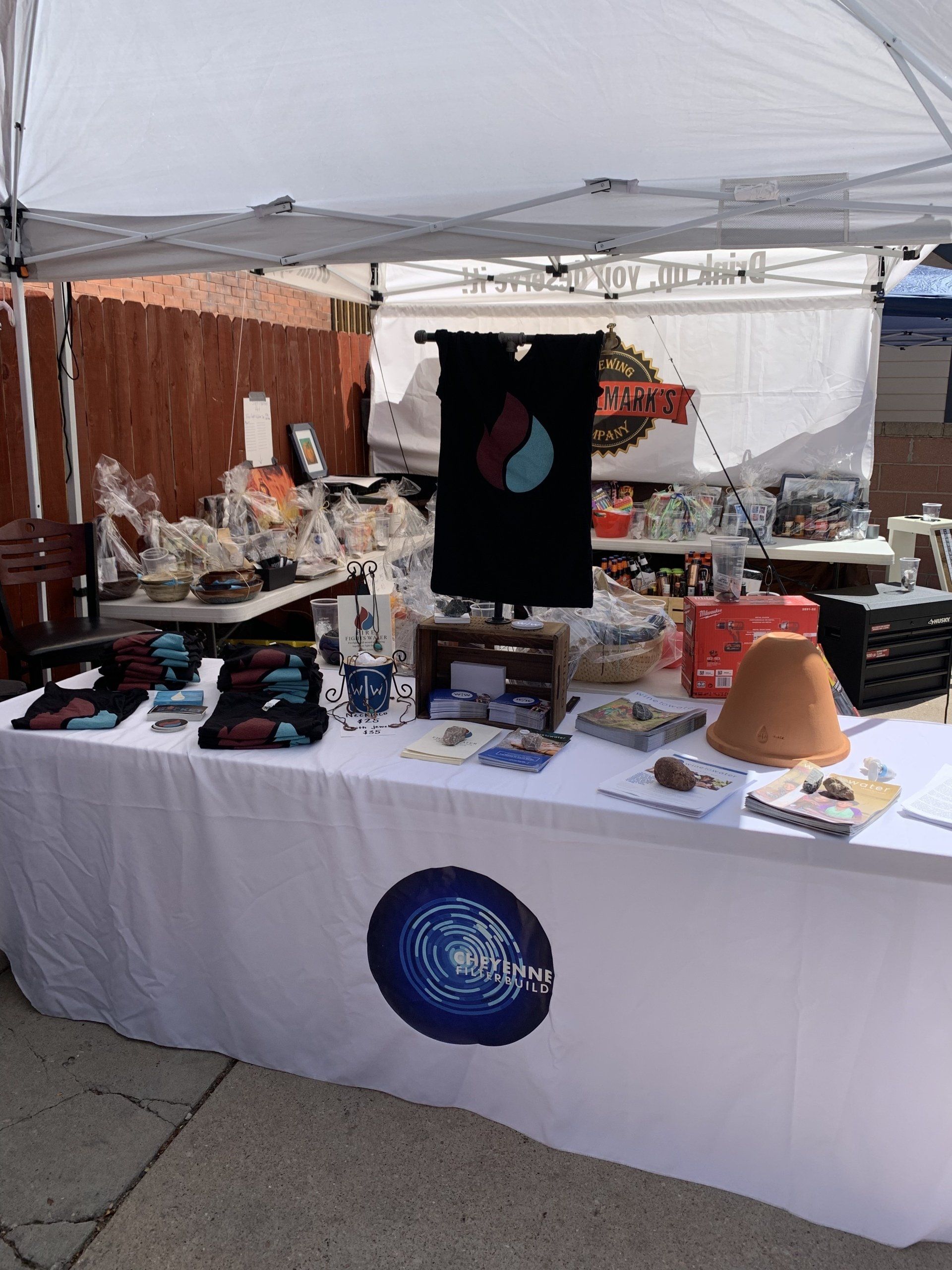 A table in front of a tent with a circle on it