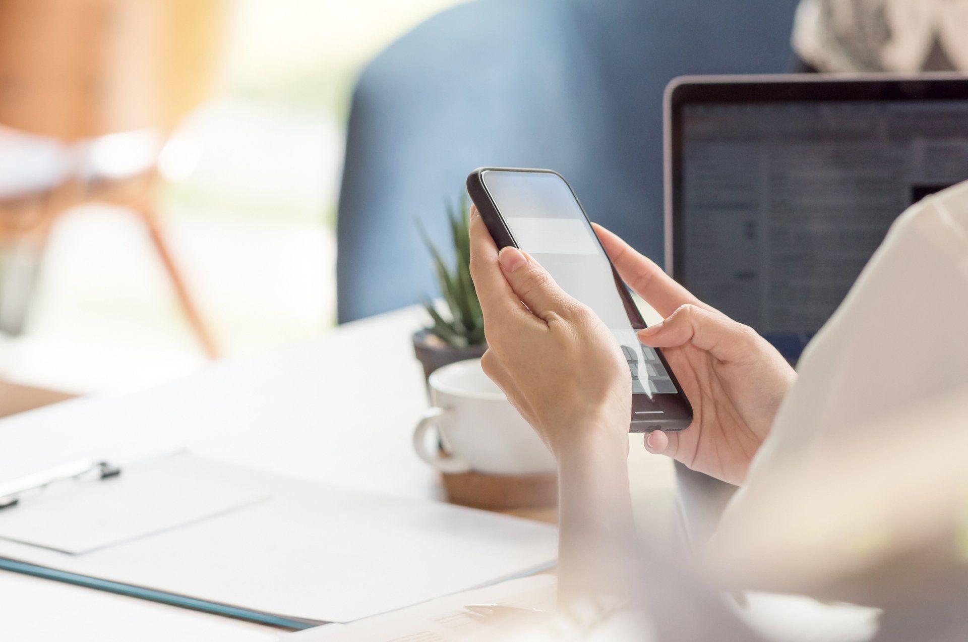 woman on cell phone and link to tenant portal sign in