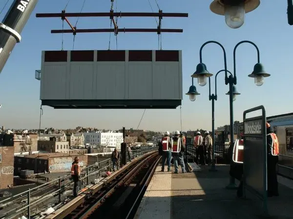 A Large Box Is Being Lifted By A Crane That Says Ba On It — Albertson, NY — Patsy Strocchia & Sons Ir
