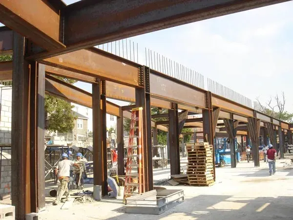 A Group Of People Are Working On A Large Metal Structure — Albertson, NY — Patsy Strocchia & Sons Ir
