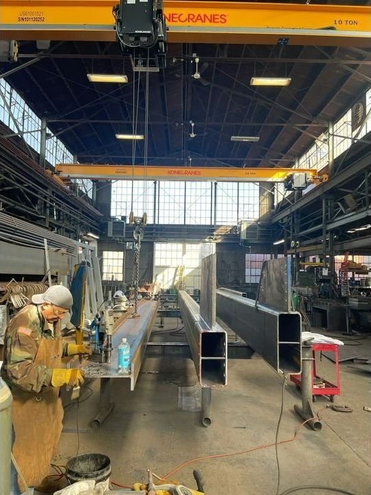 A Bunch Of Metal Pipes Are Stacked On Top Of Each Other — Albertson, NY — Patsy Strocchia & Sons Ir
