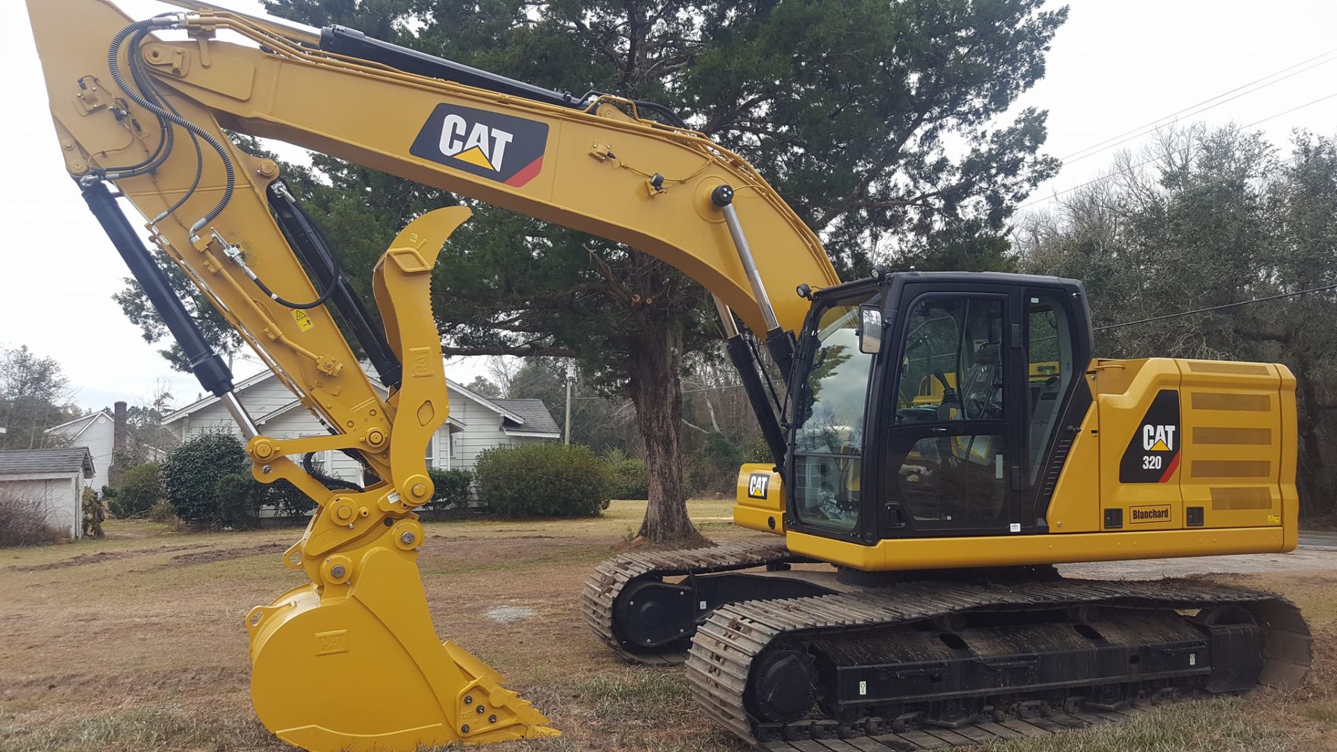 excavator in mobile home lot