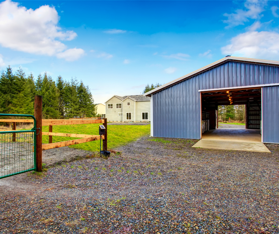 gravel driveway in front of barn