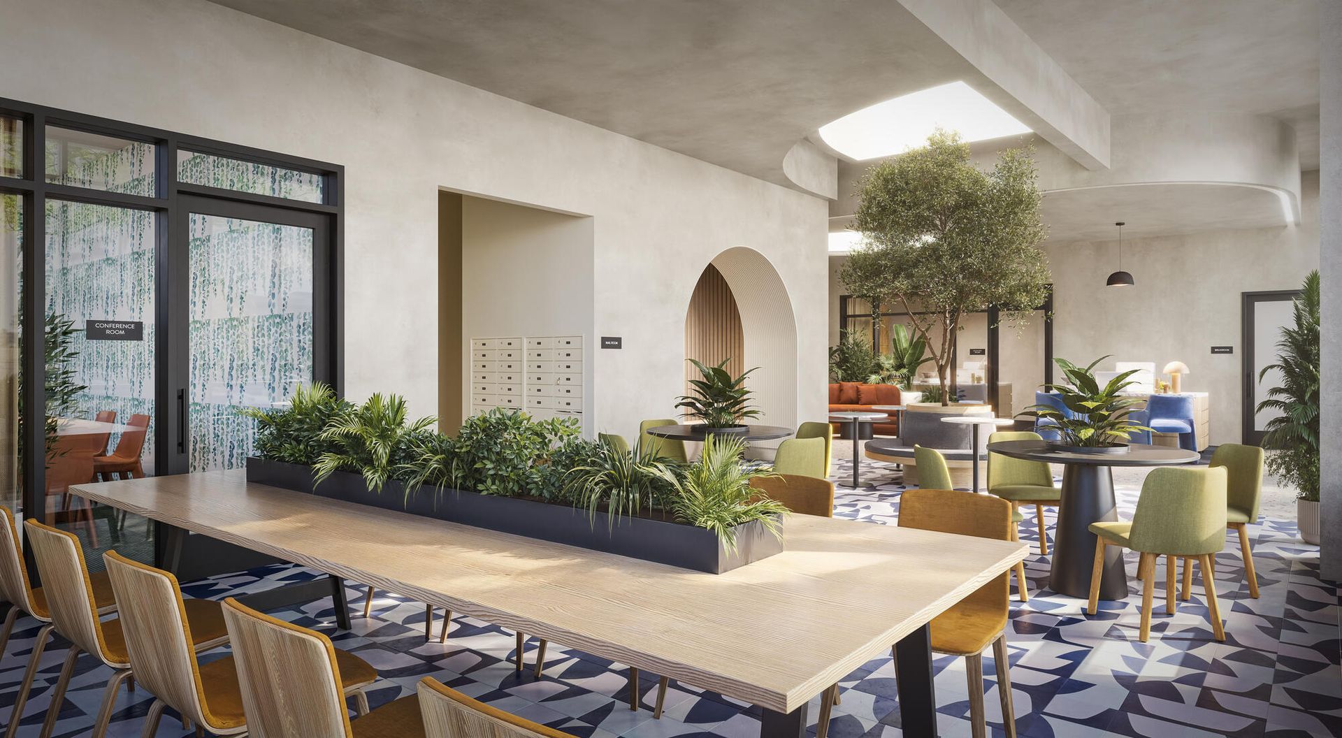 A light-filled co-working space with long tables, chairs, plants, and arched doorway, with sunlight streaming in.