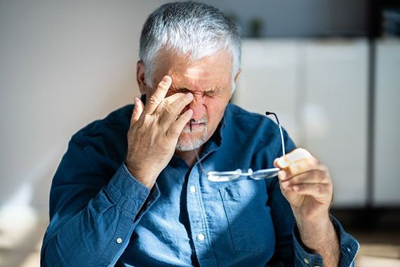 Old man scratching his eyes — Munster, IN — Munster Eye Care Associates