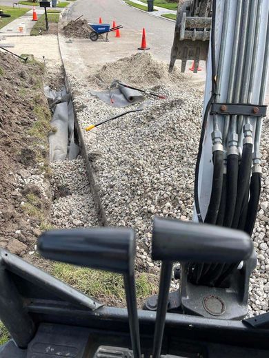 A bulldozer is digging a hole in the ground.