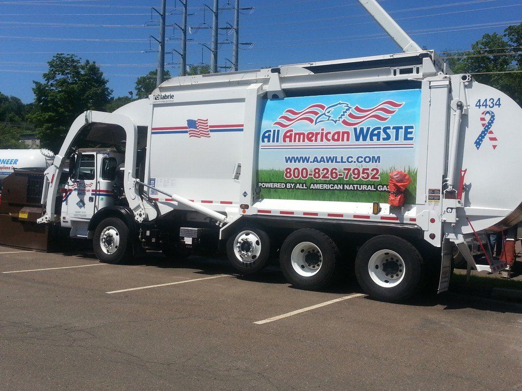 An All American Waste front load truck at the Touch A Truck event at the Jewish Community Center of Greater New Haven in Woodbridge, CT