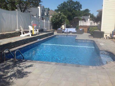 Ground Swimming Pools — Swimming Pool with Basketball Ring in Newbury, MA