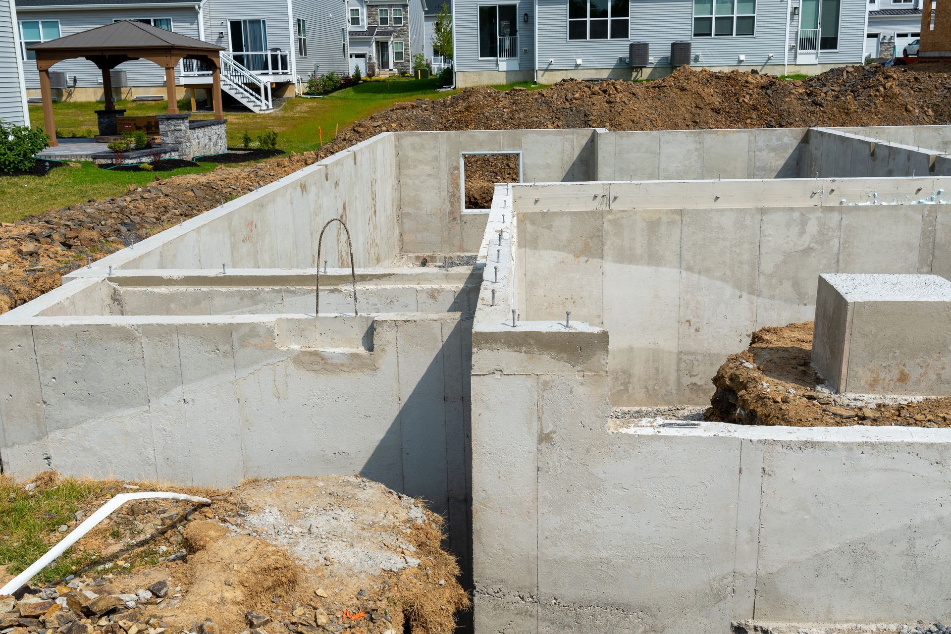 Foundation of a building under construction, concrete walls with open spaces.