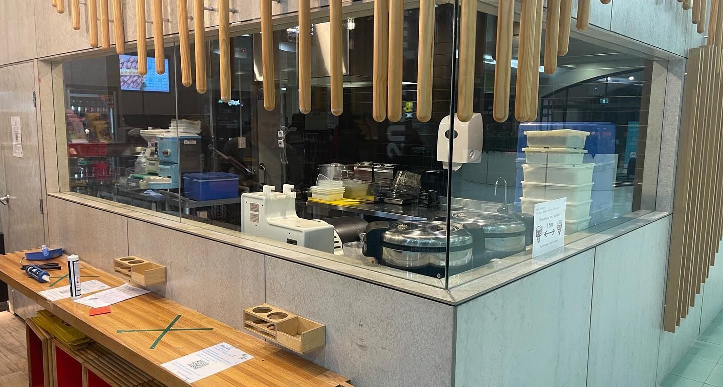 A Kitchen With a Lot of Utensils Hanging From the Ceiling — Tuggerah Lakes Glass In Long Jetty, NSW