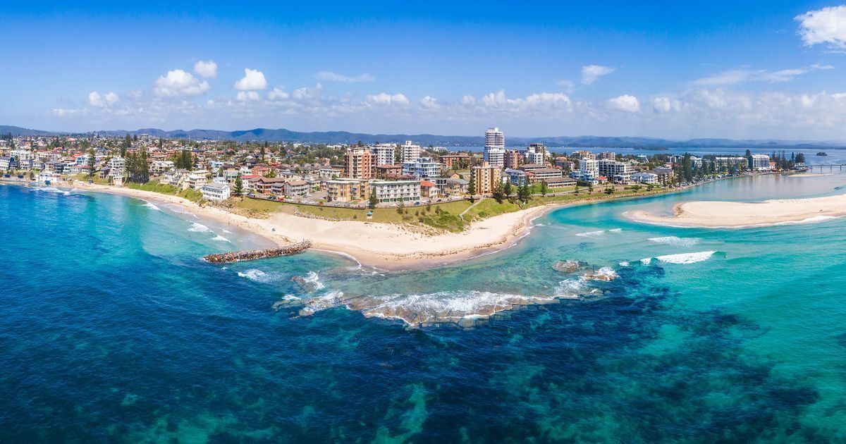 An Aerial View of a City on a Small Island in the Middle of the Ocean — Tuggerah Lakes Glass In The Entrance, NSW