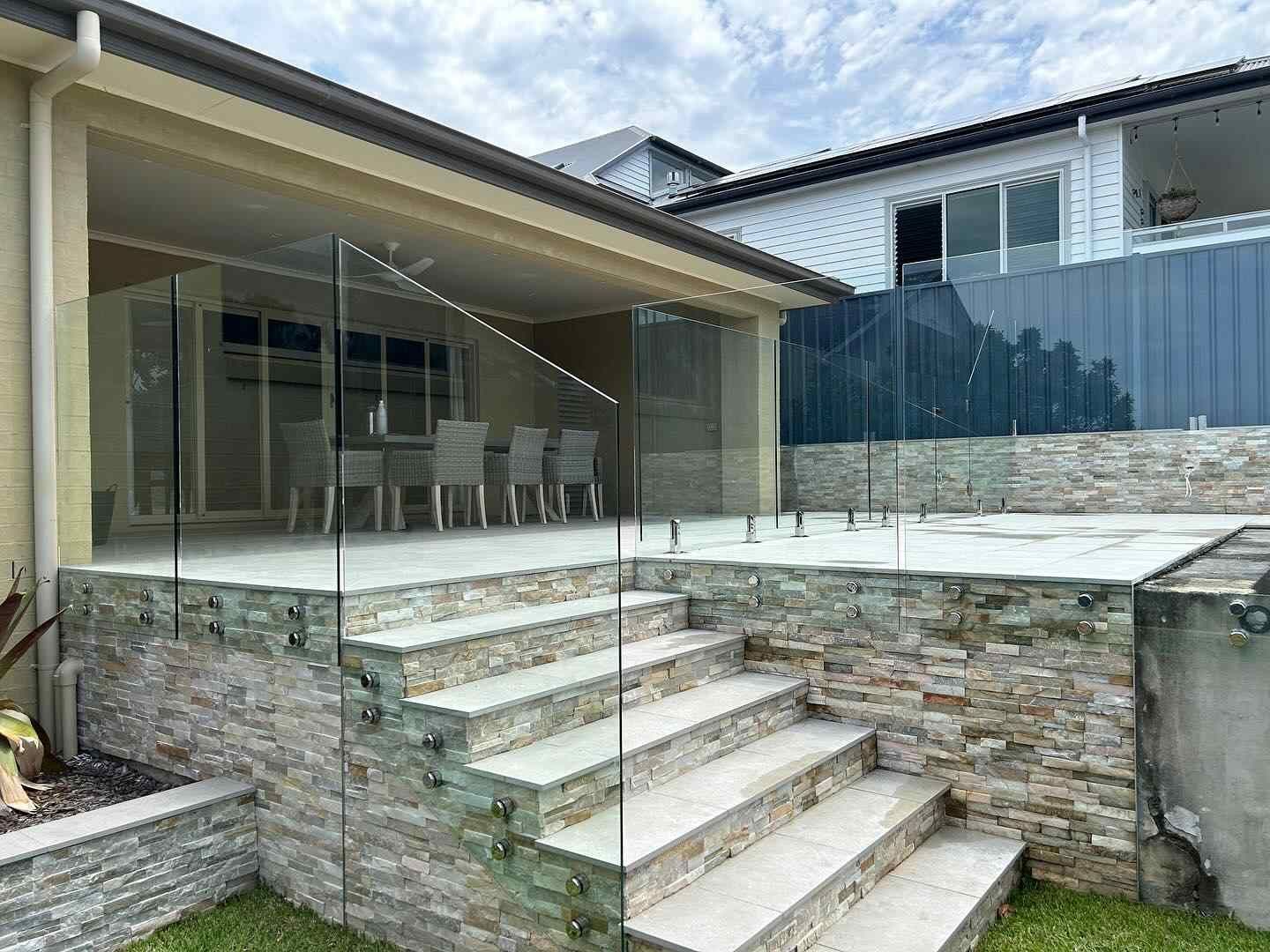 A House With a Swimming Pool and Stairs Leading Up to It — Tuggerah Lakes Glass In Tumbi Umbi, NSW