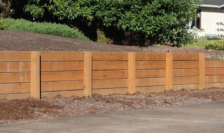 A Brick Wall with A Brick Walkway in Front of It — Fencing Around Town Townsville in Garbutt, QLD