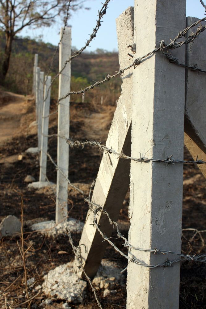 A Barbed Wire Fence is Surrounded by Concrete Posts — Fencing Around Town Townsville in Garbutt, QLD