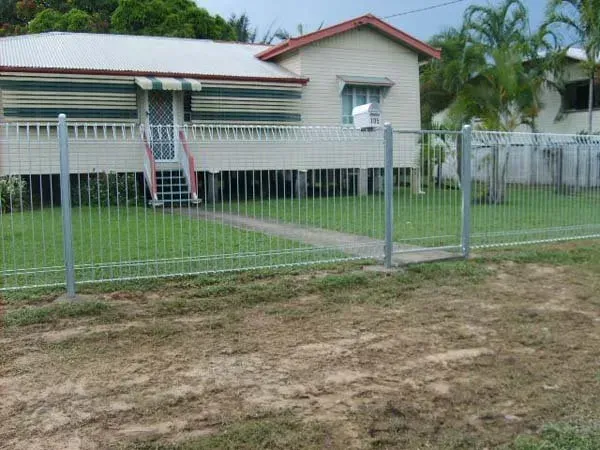 A White House with A Metal Fence Around It  — Fencing Around Town Townsville in Garbutt, QLD