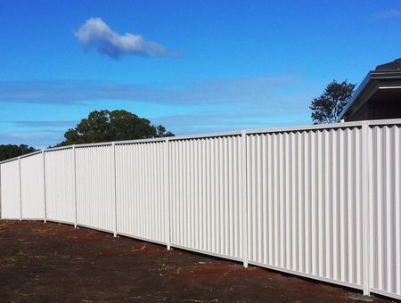 A White Wall With a Black Fence and a Gate — Fencing Around Town Townsville in Garbutt, QLD