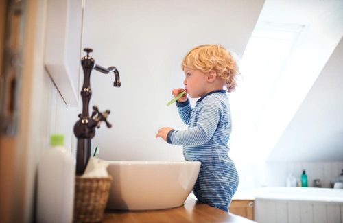 A Kid Brushing His Teeth Alone — Indianapolis, IN — Hollander, Jay A