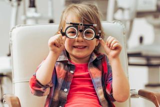 Pediatric Care — Happy Girl Wearing Optical Equipment in Manhattan, KS