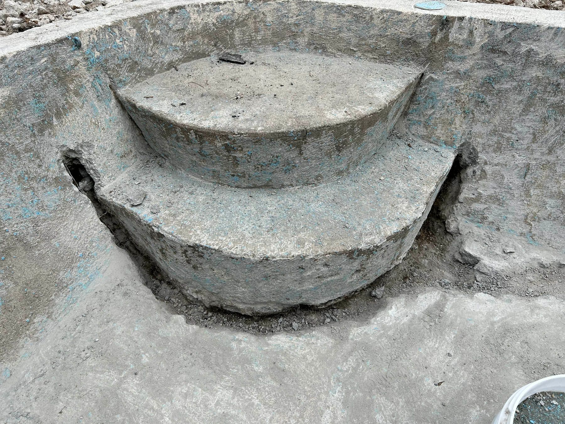 Concrete pool steps under construction.