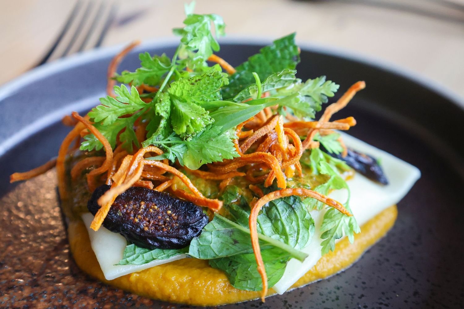 A close up of a plate of food on a table