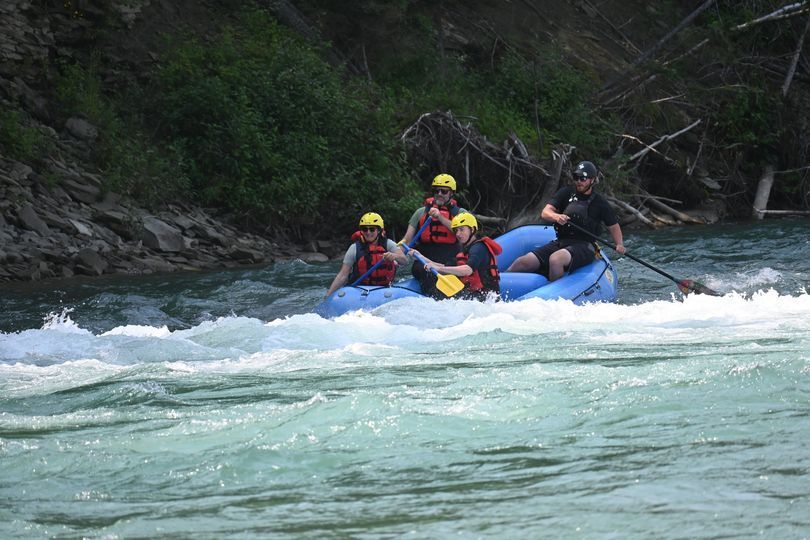 A group of people are rafting down a river.